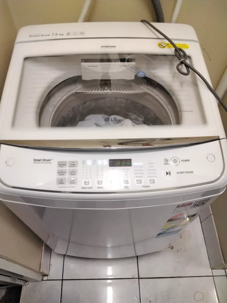 An LG-branded top-loading washing machine working a cycle in a NAR client’s home.