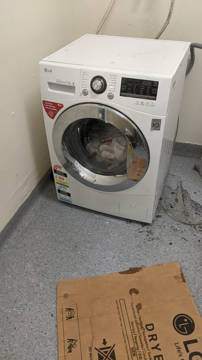 An LG-branded washing machine, of the front-loading kind, in a NAR client’s home.