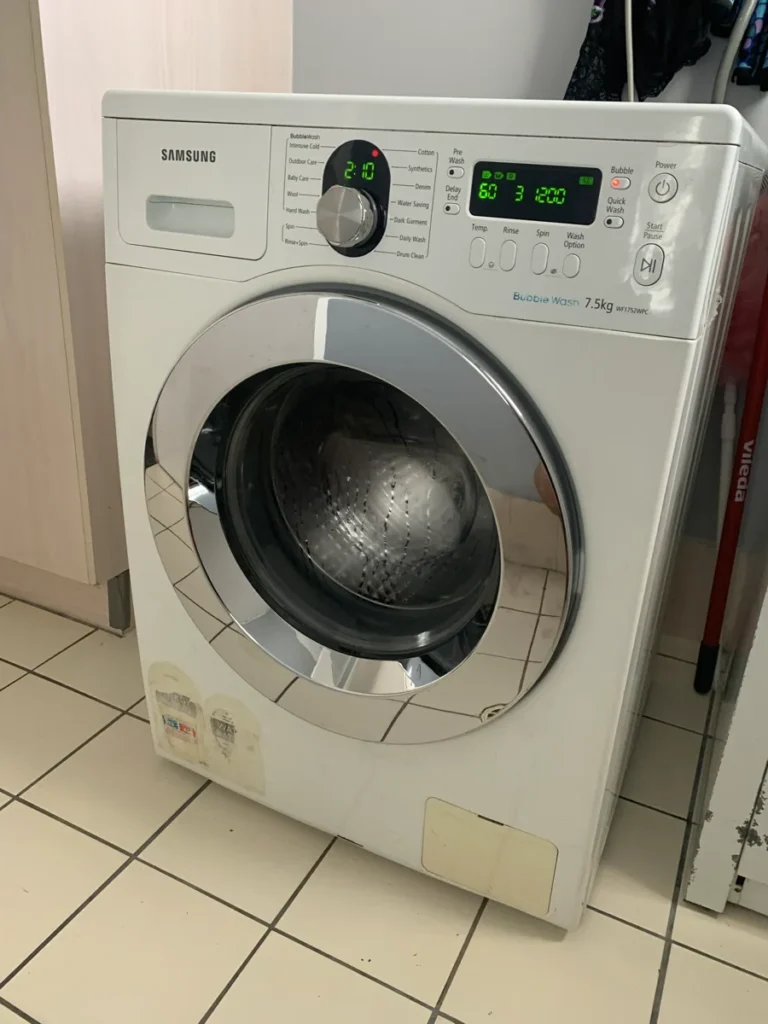 Samsung washing machine with the control panel lit up in a NAR client’s home.