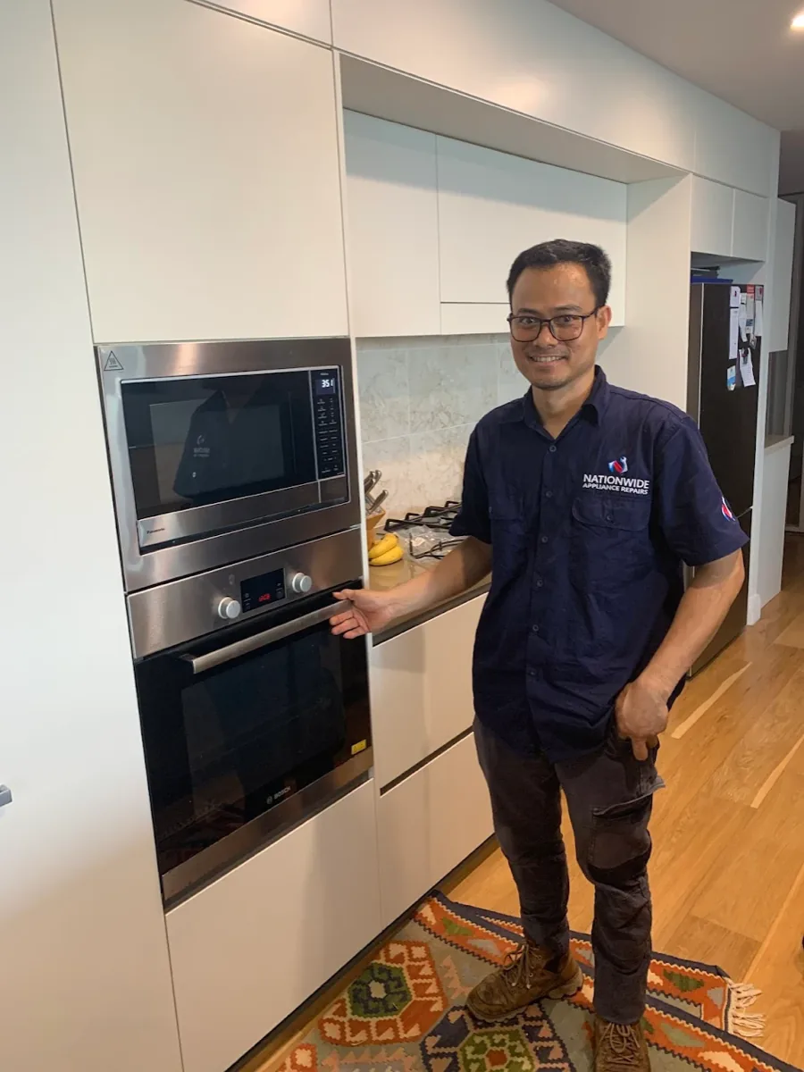 NAR technician with a Bosch electric oven.