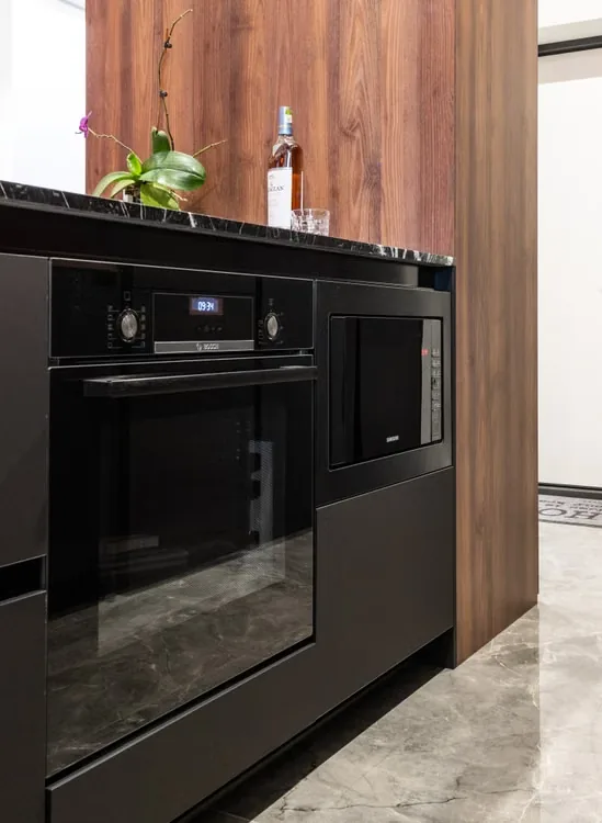 Integrated modern oven and microwave in a kitchen