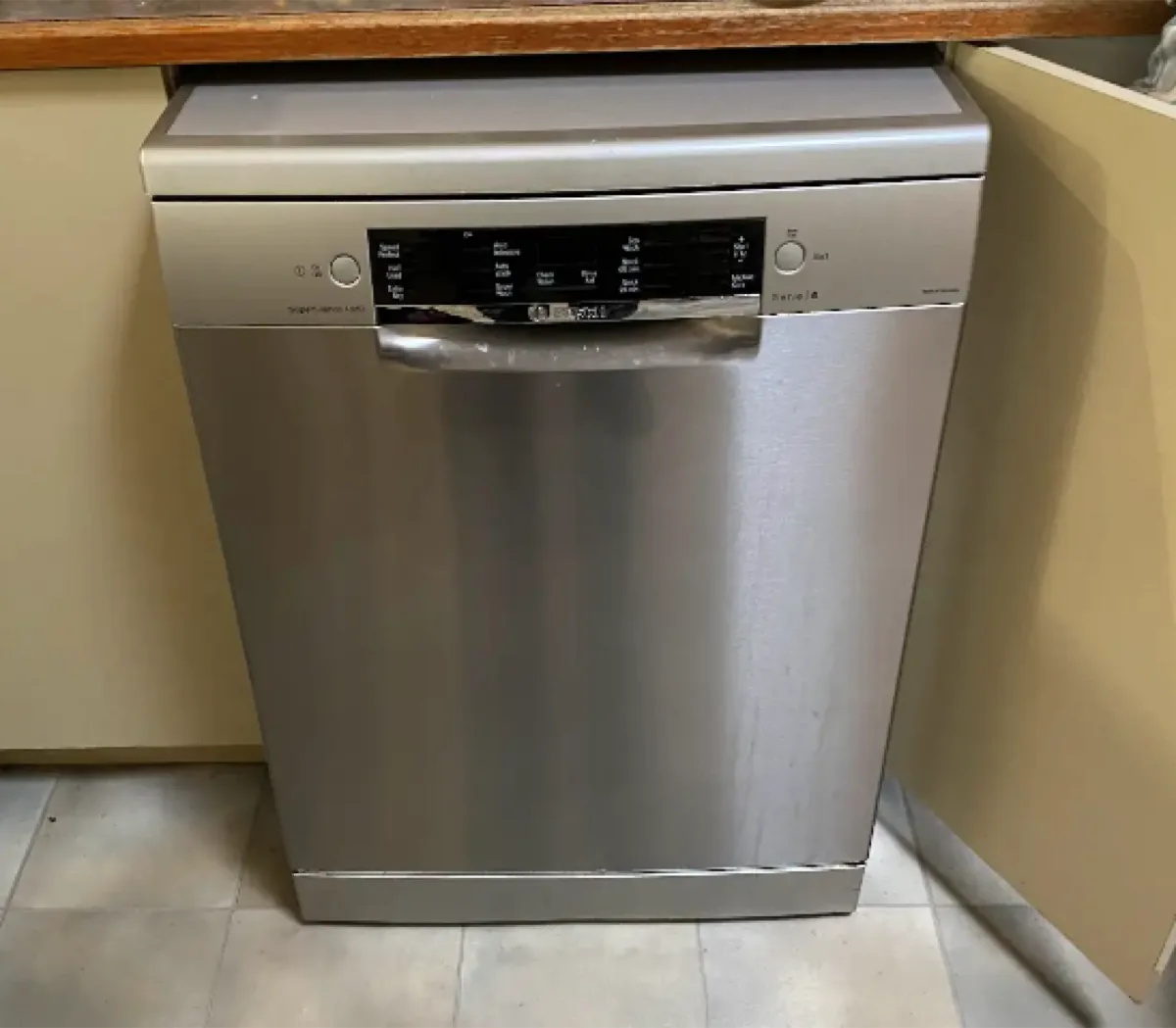 Bosch dishwasher, with metallic texture, in a NAR’s client’s kitchen.