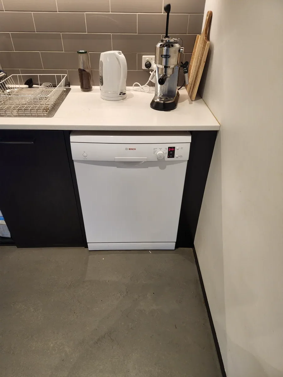 Bosch white dishwasher in a client’s kitchen.