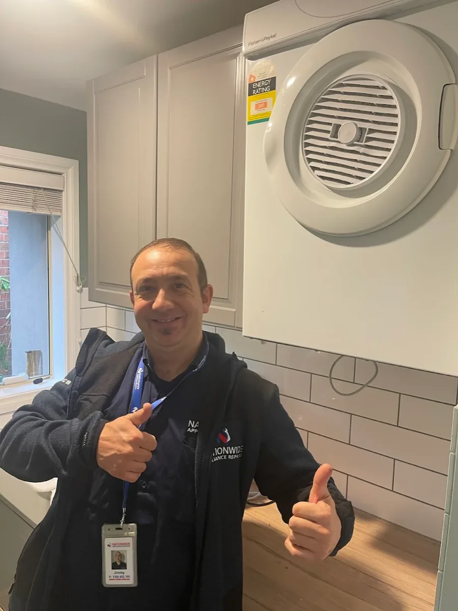 Fisher & Paykel’s dryer with a NAR’s technician in front.