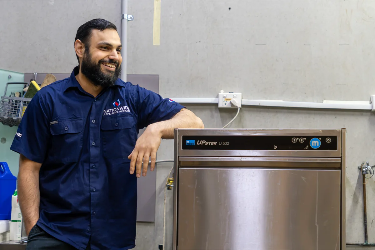 Meiko appliance with a NAR technician next to it.