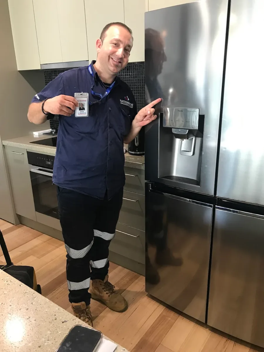 LG ThinQ’s fridge in a client’s home with a NAR technician standing in front of it.