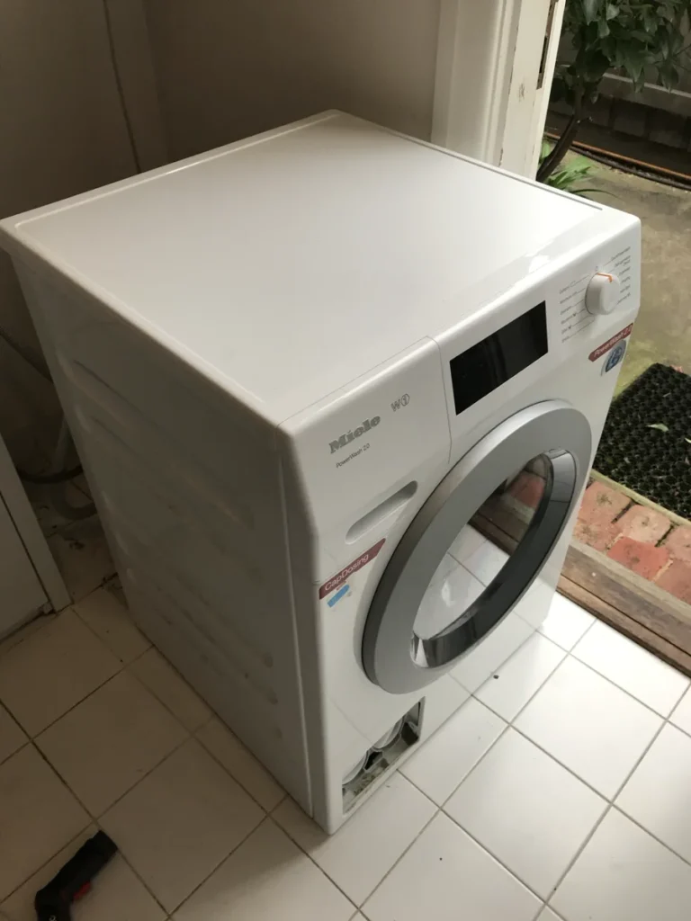 Miele’s white washing machine in a NAR’s client’s home.