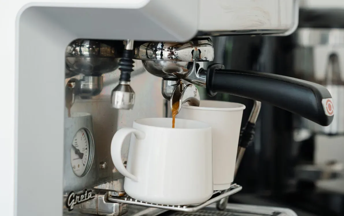Coffee making process in modern cafe.